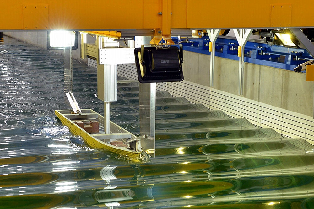 Hull model being tested in a test tank.